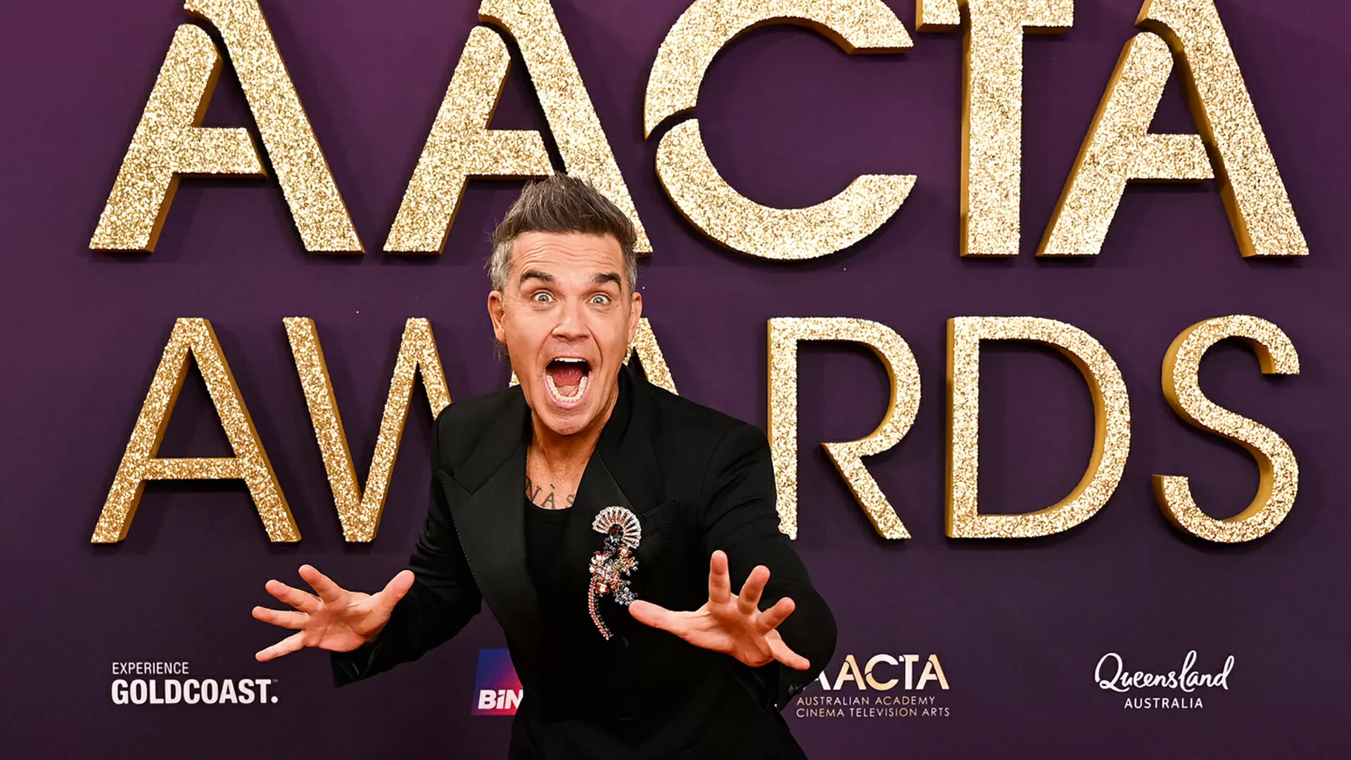 O recorde de 26 anos dos Beatles que foi derrubado por Robbie Williams